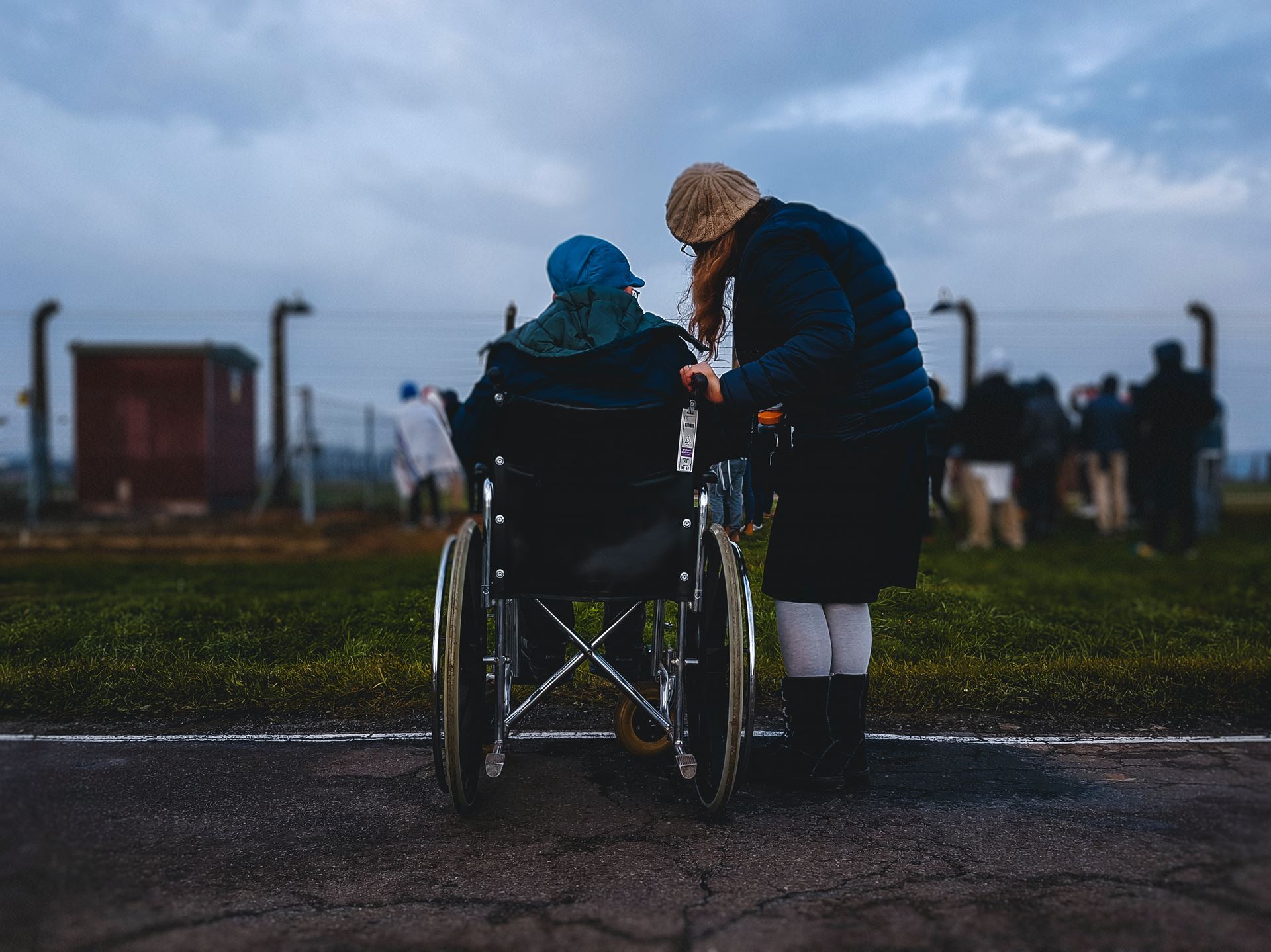 young person with older person in a wheelchair
